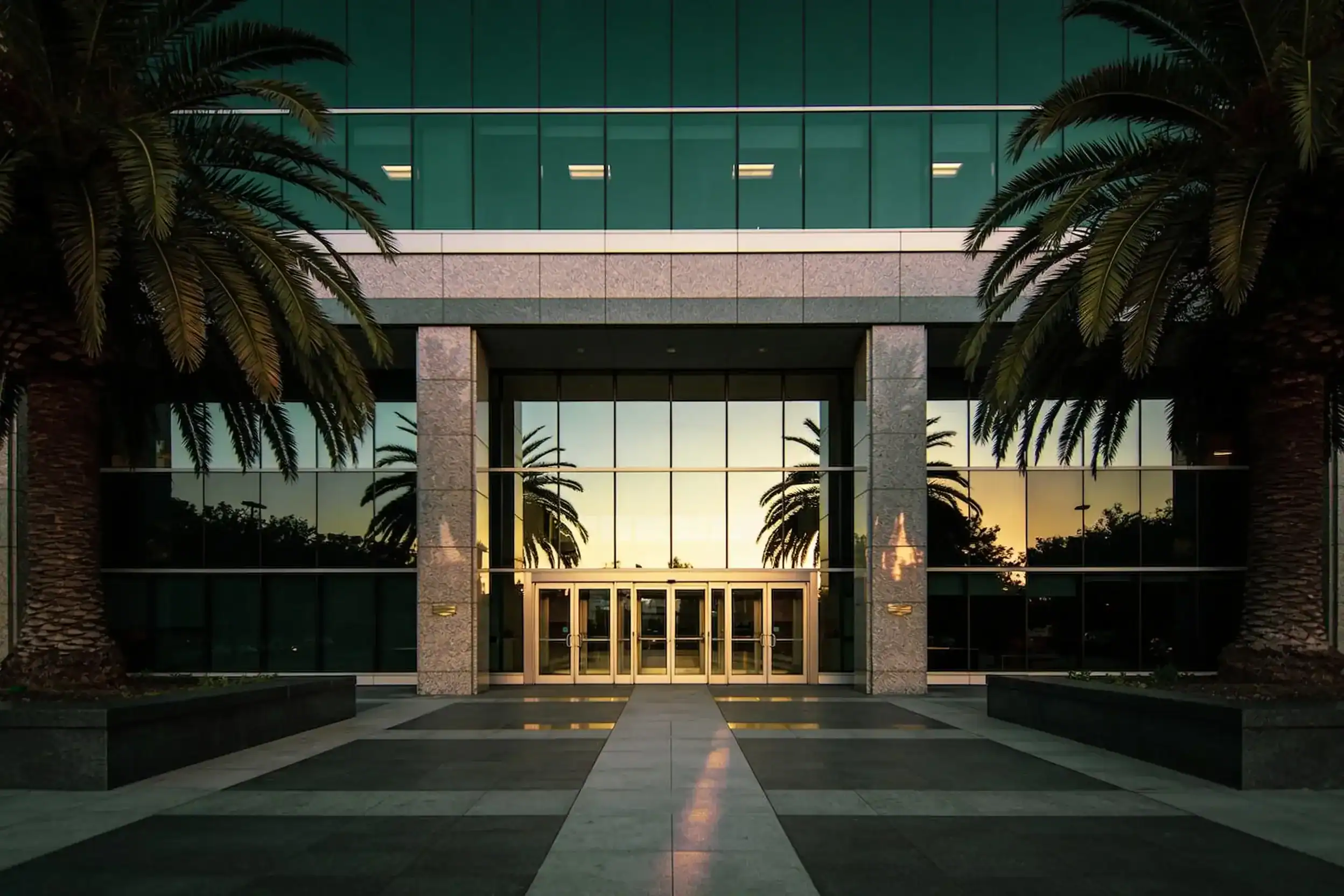 Class-A commercial building exterior at dawn